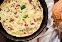 Rustic French Omelette with Crispy Bacon, Tender Potatoes, and Garden Zucchini
