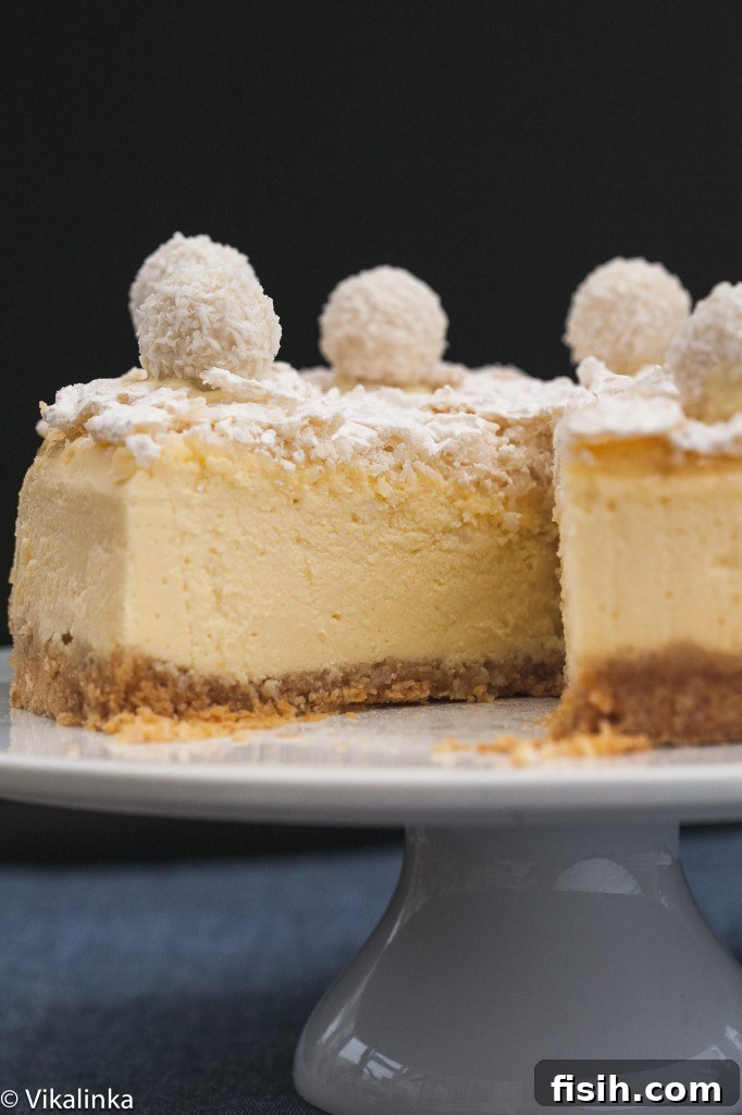 The full cheesecake shown with one perfect slice already removed, inviting viewers to imagine its deliciousness.