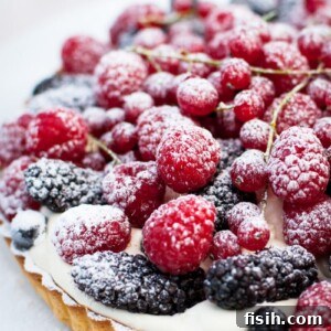 Close up of mixed berries beautifully arranged on top of the Summer Berry Tart.