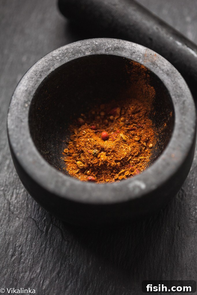 Moroccan Chicken and Roasted Veggie Couscous Bowl 3 Mortar and pestle filled with colorful Moroccan spices, ready for grinding