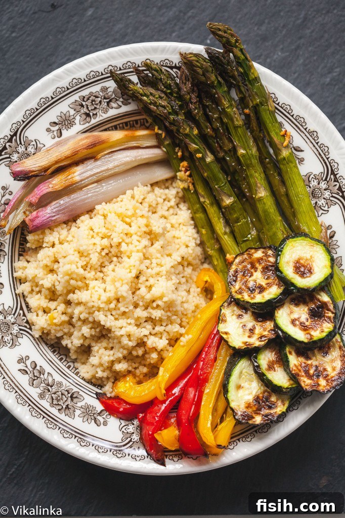 Moroccan Chicken and Roasted Veggie Couscous Bowl 6 Top down view of the couscous bowl, beautifully arranged before the final dressing, showing various ingredients