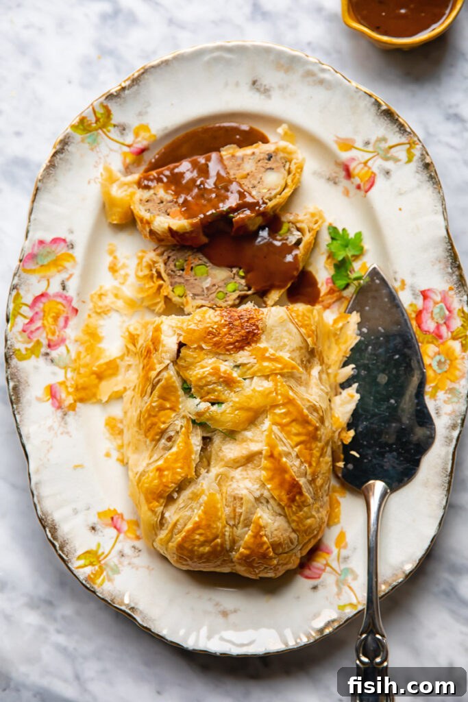 Rustic Ground Beef Wellington 6 serving platter of wellington and gravy from overhead