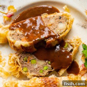 slices of ground beef wellington with gravy