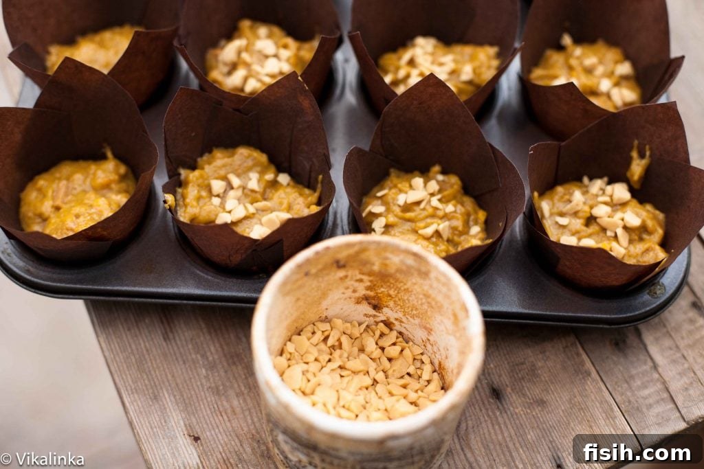 Golden Pumpkin Muffins with Toffee Honeycomb Crunch 6 Golden toffee pieces glistening in a glass jar, with the soft blur of freshly baked goods in the background, ready for their sweet inclusion.
