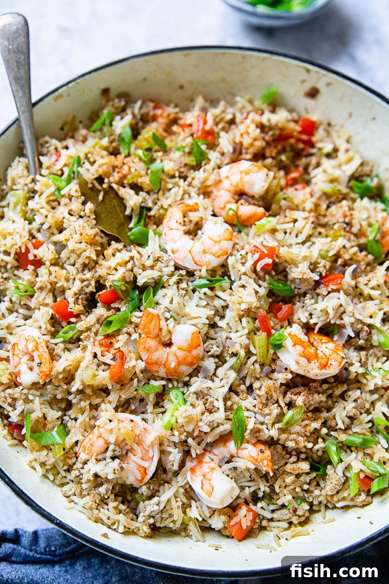 Top down of pan of Cajun Dirty Rice with Shrimp, showing the rich color and textures