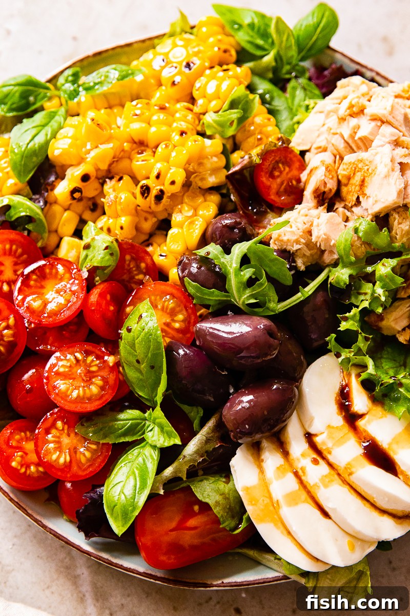 Fresh Italian Tuna Salad with Corn and Mozzarella 2 Authentic Italian Salad with cherry tomatoes, tuna, corn, olives and fresh mozzarella