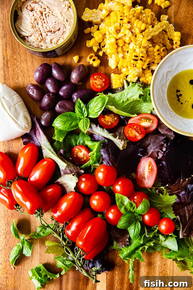 Fresh Italian Tuna Salad with Corn and Mozzarella 3 Fresh Italian Salad Ingredients on a rustic cutting board