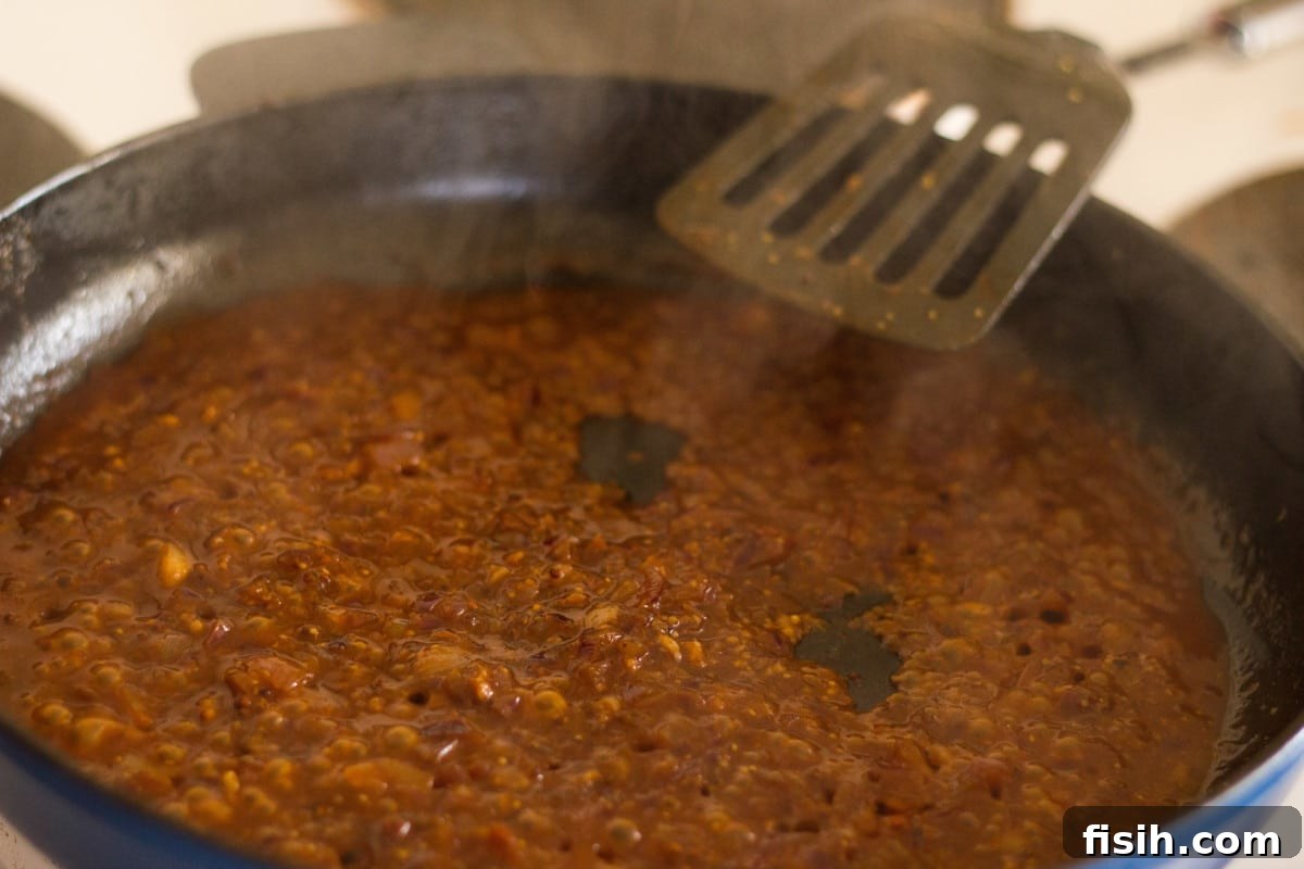 Process shot of sauce cooking in pan