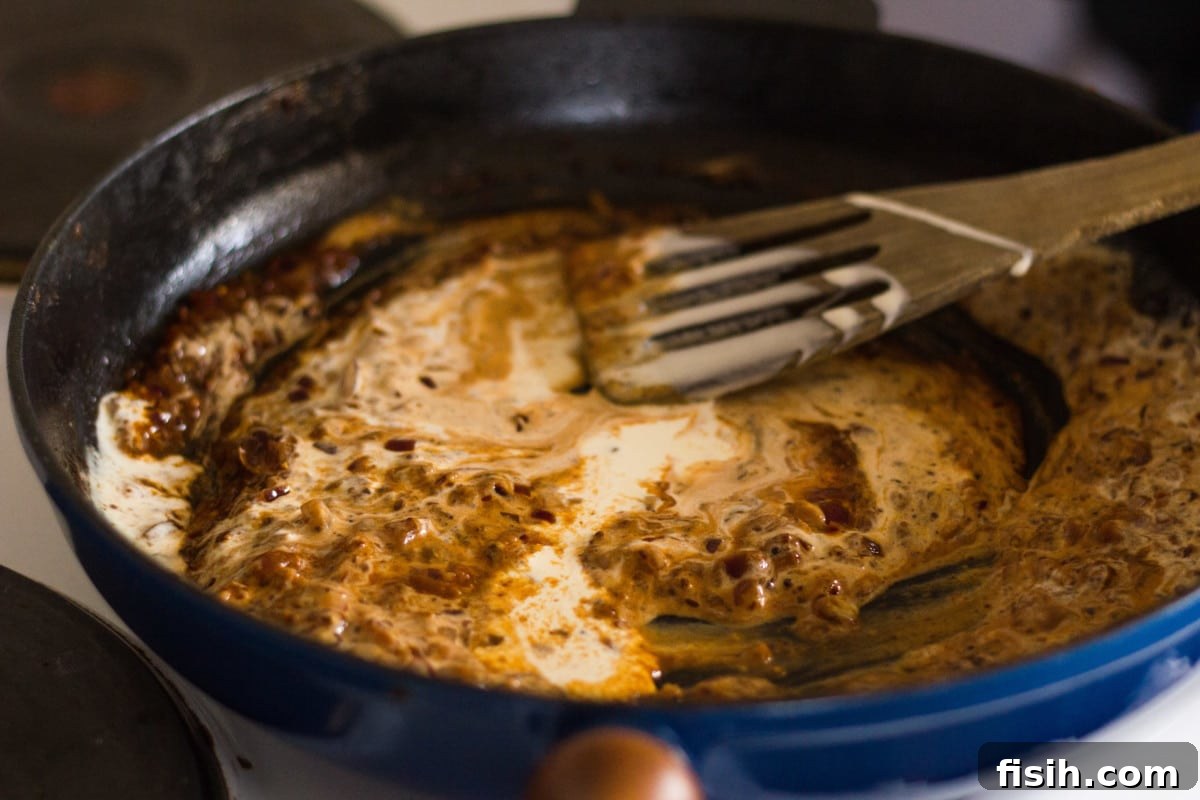Side shotsauce ingrediants being stirred in a pan
