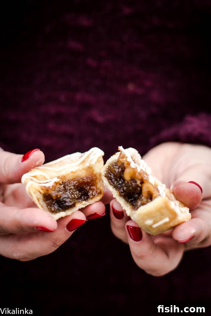 Maple Butter Tart broken in half with filling exposed