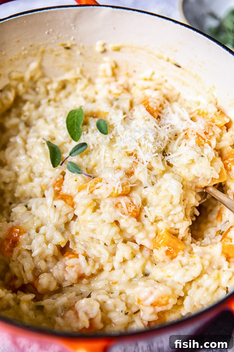 Velvety Butternut Risotto with Aromatic Sage and Creamy Goat Cheese 3 Close up of Butternut Squash Risotto cooking in a pan