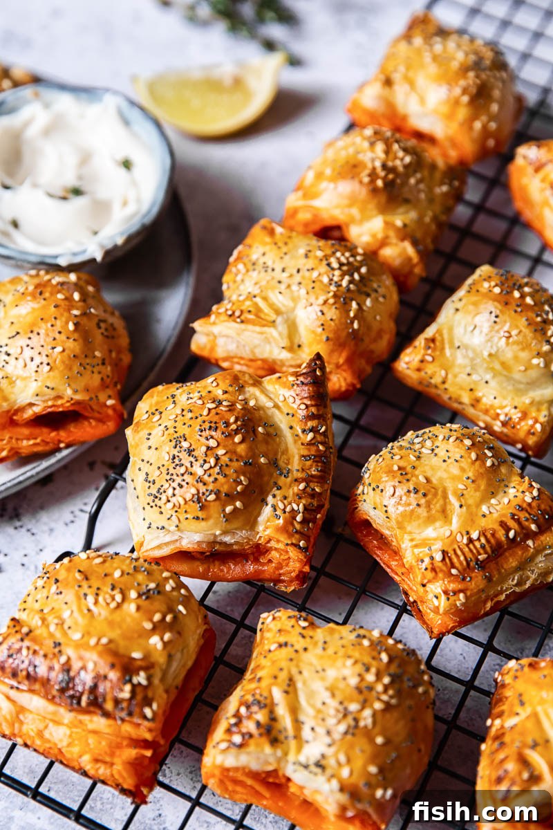 Chorizo sausage rolls cooling on a wire rack, perfectly golden