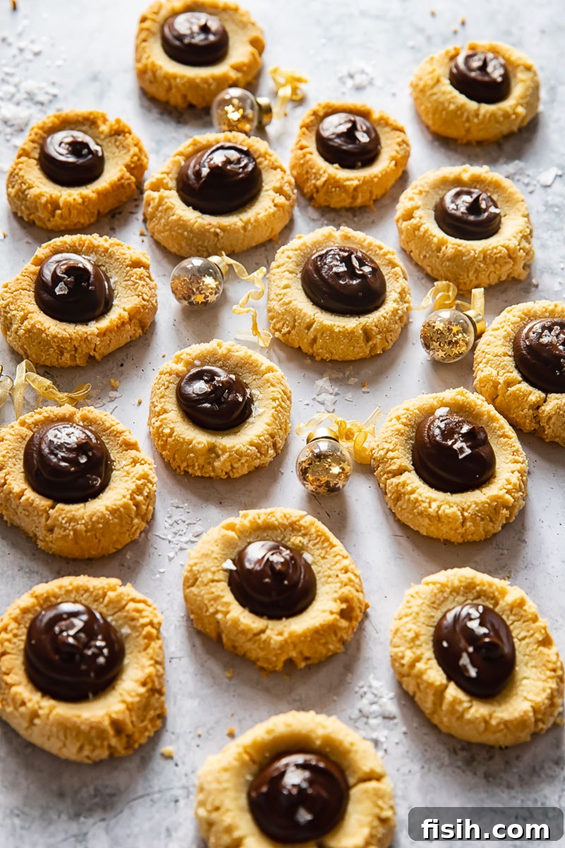 Irresistible chocolate thumbprint cookies with sea salt on a light background, ready for the holidays.