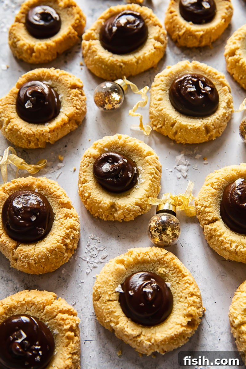 Artfully arranged almond thumbprint cookies with chocolate and sea salt, showcasing their delightful appearance.