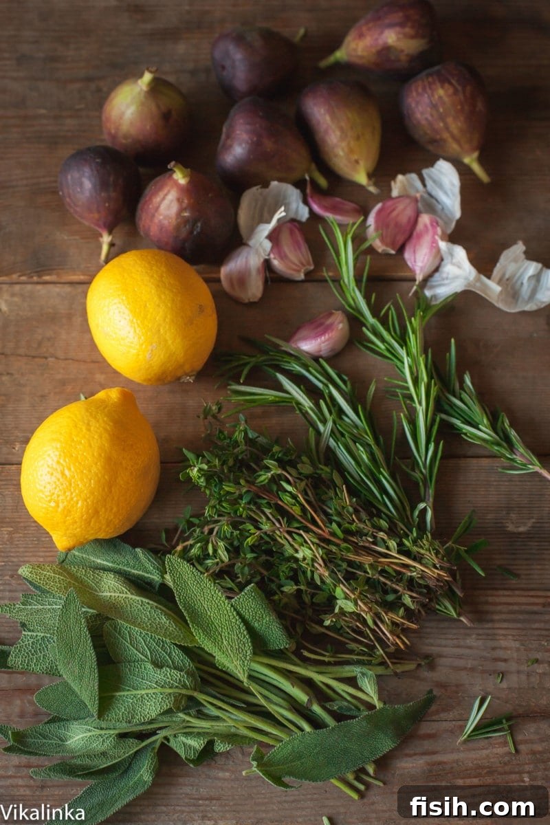 A selection of fresh herbs, garlic, lemons, and figs, key ingredients for flavoring a roast turkey