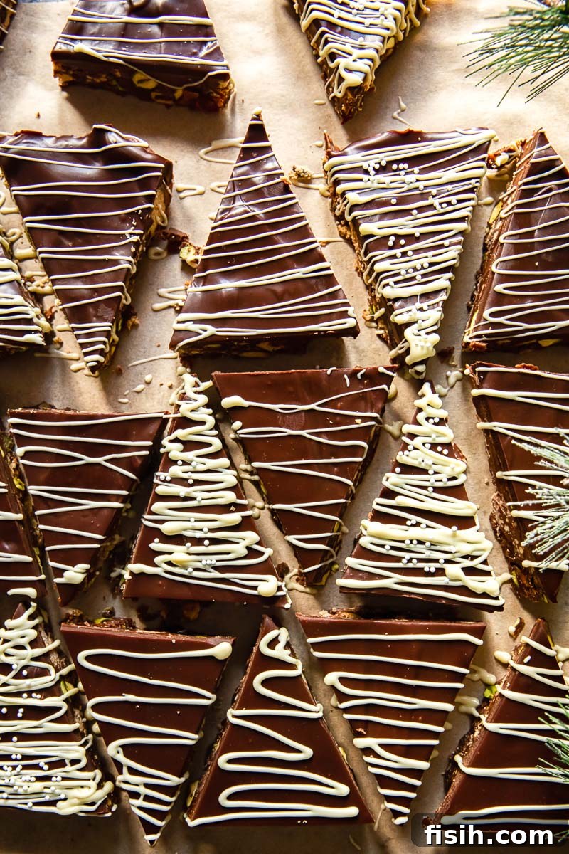 Finished fridge cake bars cut into mini Christmas trees, ready for serving or gifting.