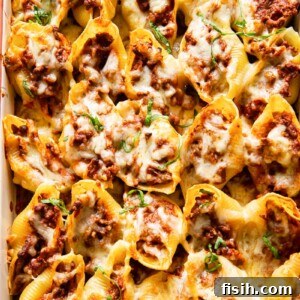 Quick Pesto Beef and Tomato Shells 6 beef stuffed giant pasta shells topped with melted closeup