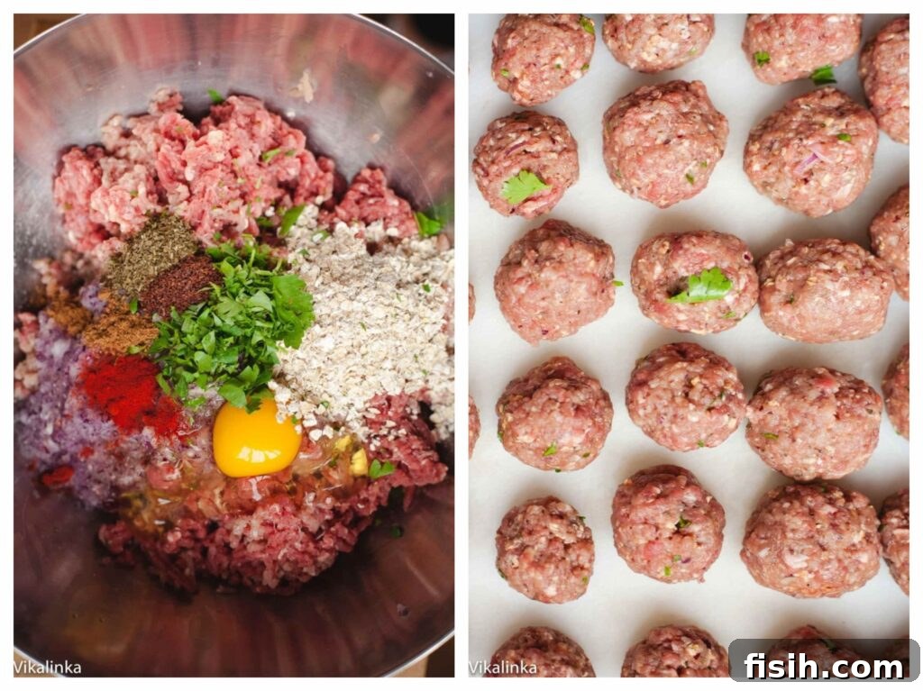 Close-up of uncooked meatball mixture ready to be shaped, with several perfectly formed meatballs next to it on a cutting board.