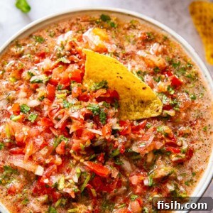 Fresh salsa in a bowl, ready to be served from the recipe card