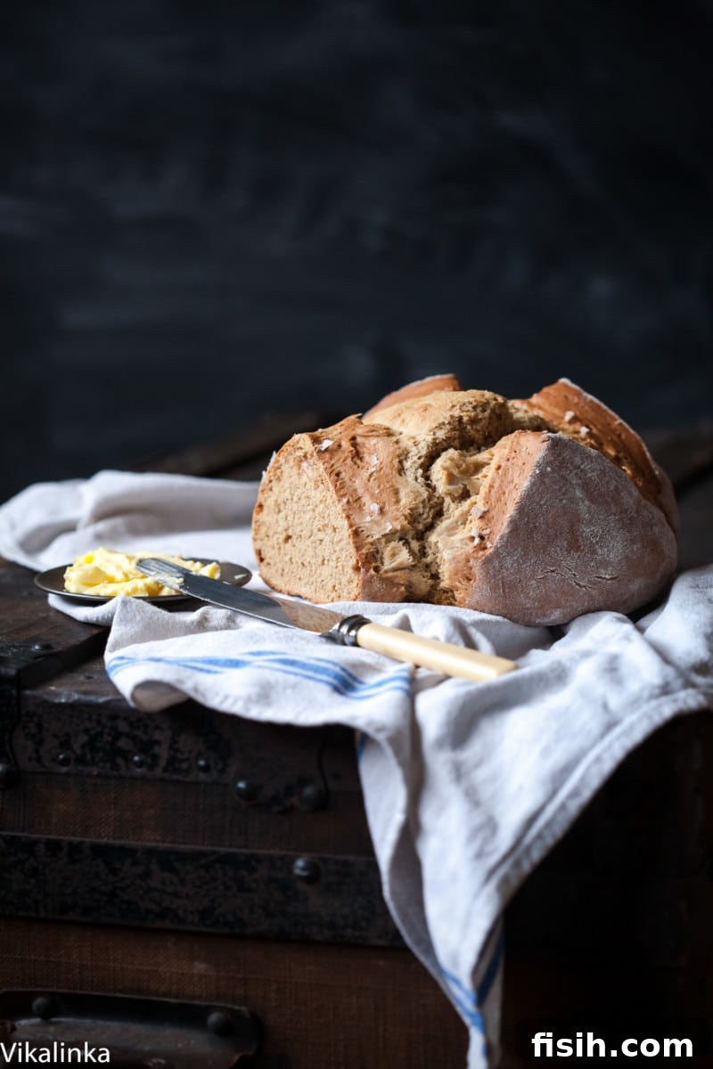 Close-up image of a full Honey Buckwheat Soda Bread loaf, ready to be sliced.