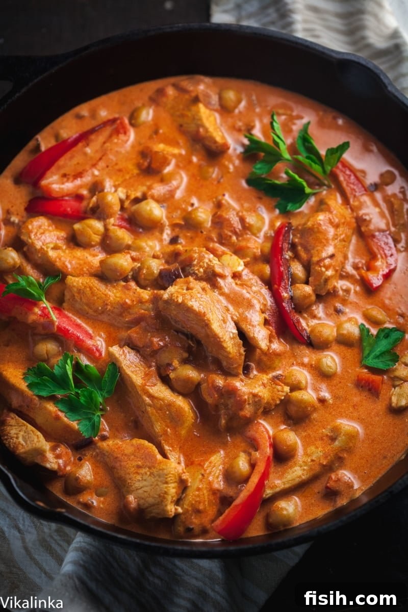 Flavorful Chicken Chickpea Paprikash in a rustic cast iron pan, ready to be served.