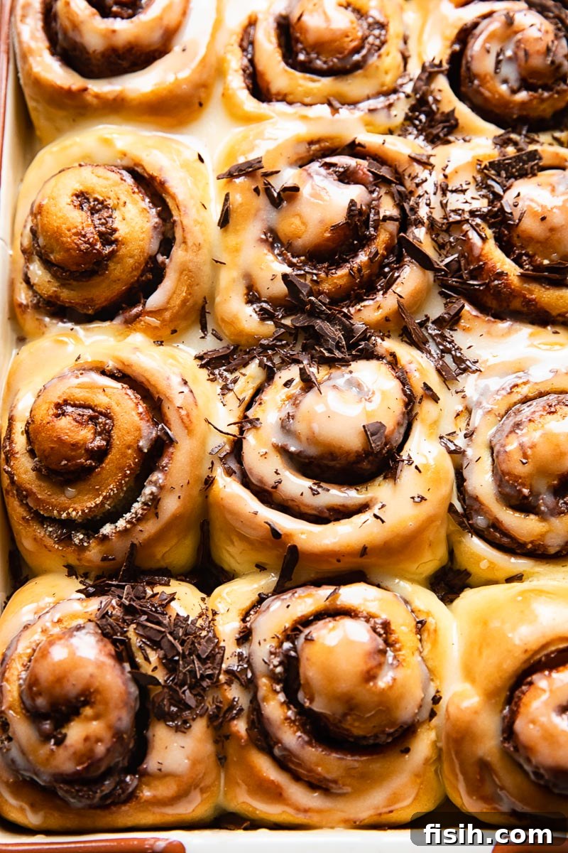 Overnight Nutella Rolls sprinkled with chopped chocolate