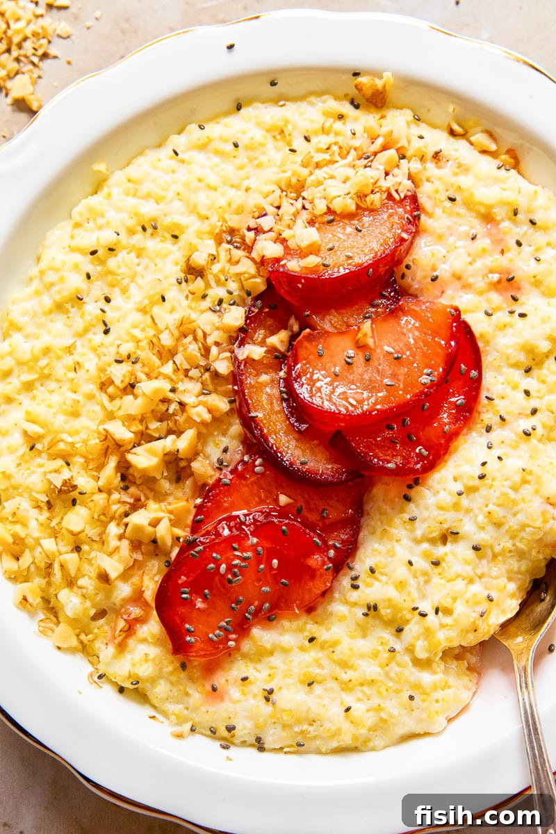Honey-Glazed Plum & Millet Delight 4 closeup image of millet porridge topped with plums, walnut and chia seeds