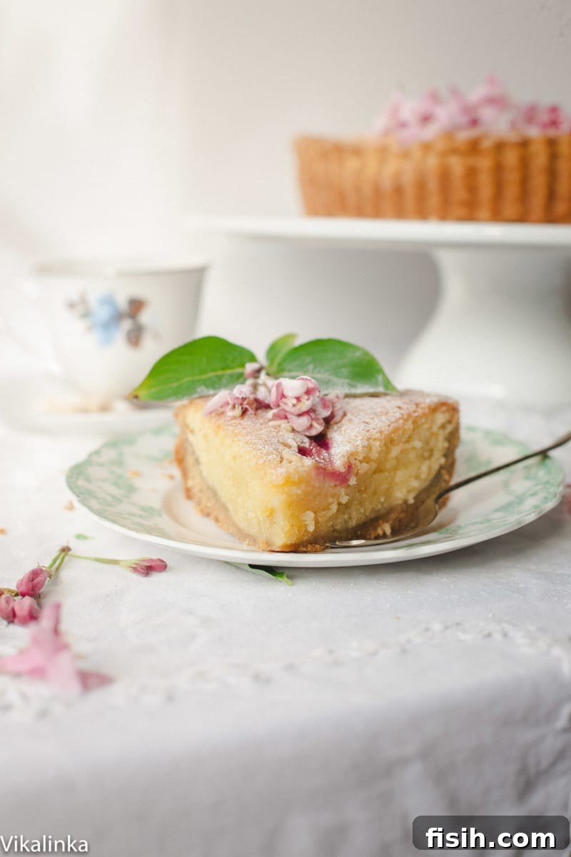 A slice of bakewell tart on a plate