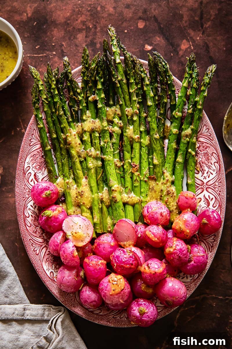 Crisp Roasted Asparagus and Radishes with Zesty Mustard Vinaigrette 2 Top-down view of beautifully roasted asparagus and radishes drizzled with a golden mustard vinaigrette, presented on a rustic platter.