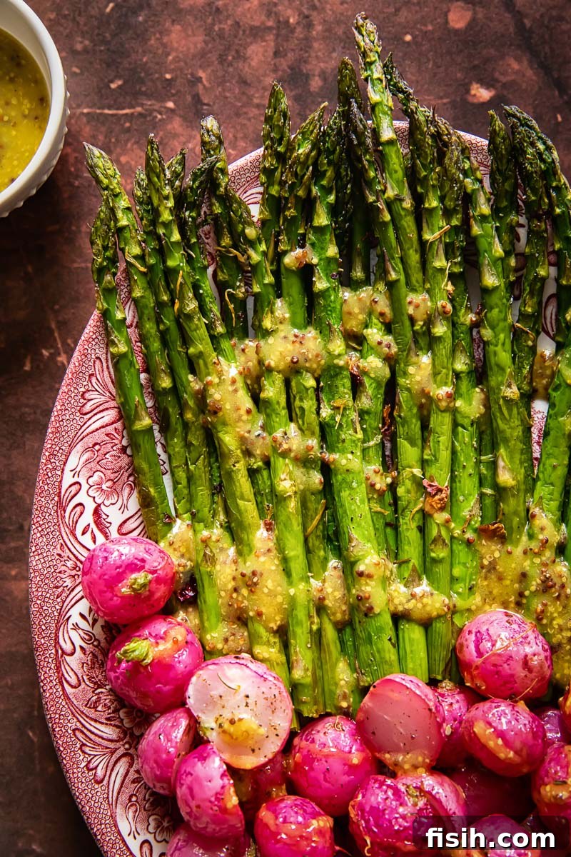 Crisp Roasted Asparagus and Radishes with Zesty Mustard Vinaigrette 6 A vibrant platter of roasted radishes and asparagus, showcasing their beautiful colors and textures, ready to be served.