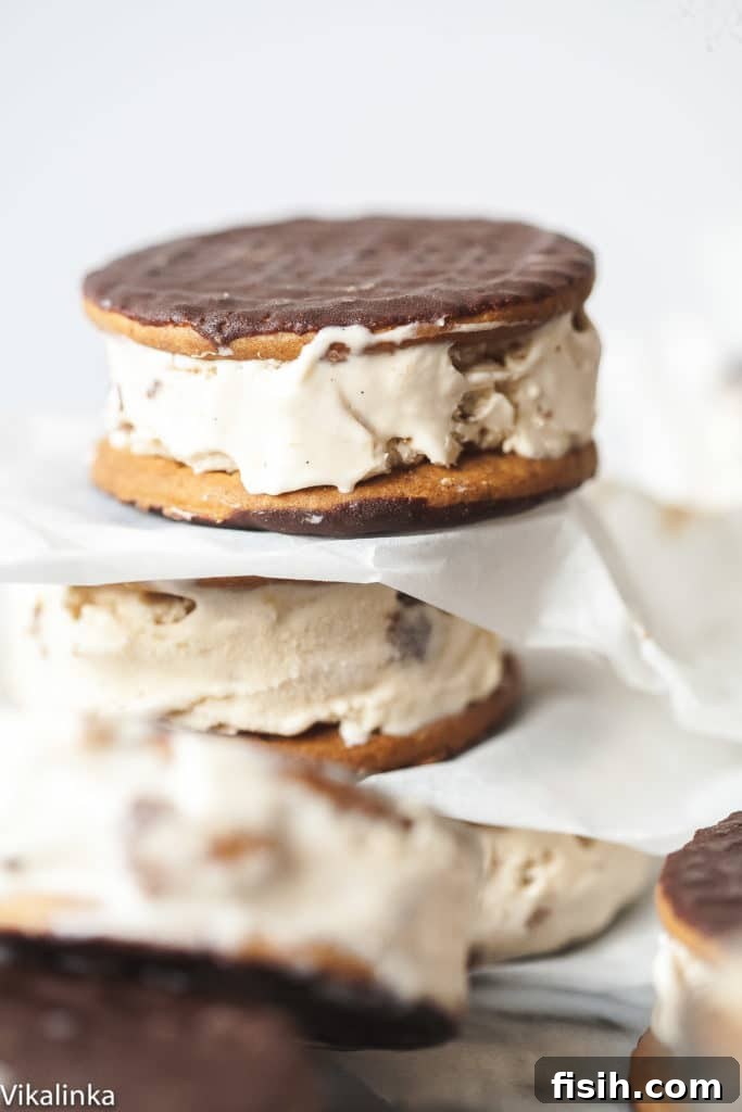 Prepared cappuccino daim ice cream sandwiches stacked with parchment paper