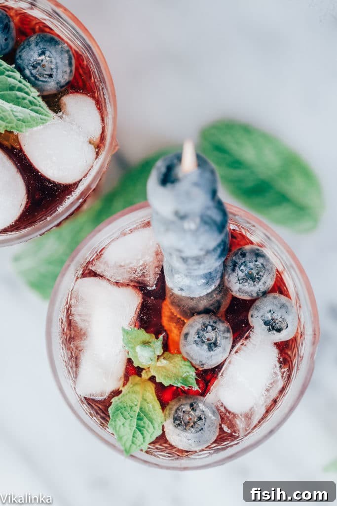 Three glasses of sparkling Vermouth Cassis, ready to be served.