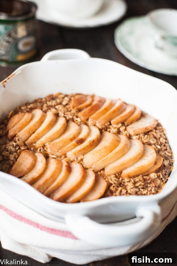 Slice of Spiced Pear Baked Oatmeal on a white plate