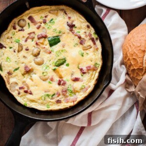 Omelette cooking in a cast iron pan, ready to serve