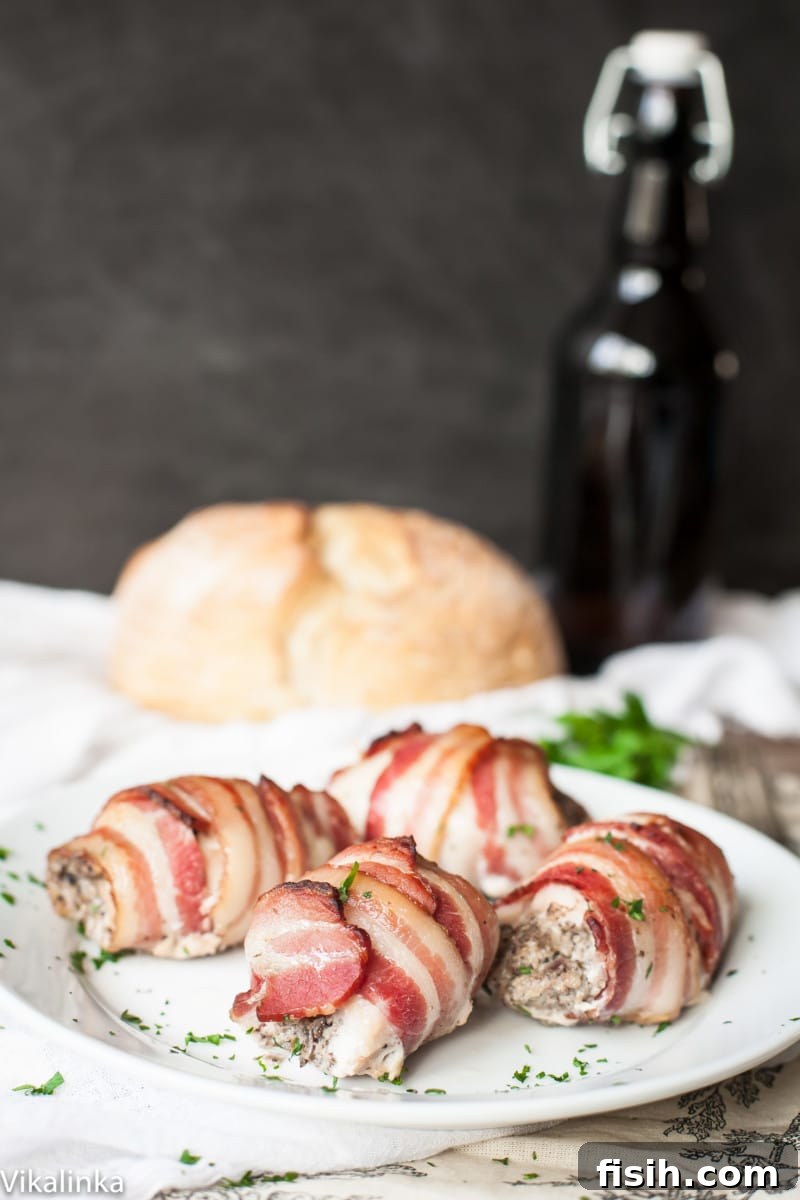 Gourmet Bacon Wrapped Chicken Thighs with Mushroom and Goat Cheese Filling 2 Side view of perfectly cooked bacon wrapped chicken thighs, showcasing their golden crisp exterior