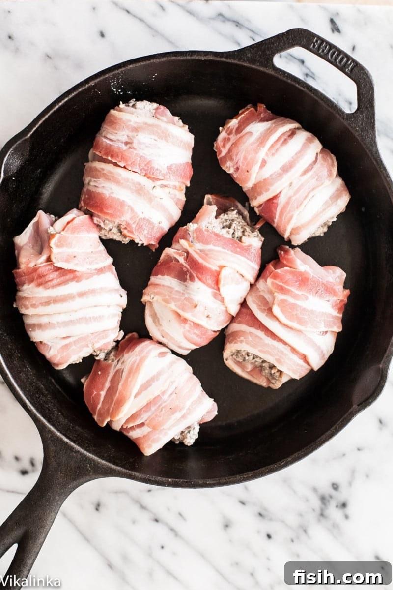 Gourmet Bacon Wrapped Chicken Thighs with Mushroom and Goat Cheese Filling 5 Process shot showing chicken thighs being prepared in a pan before baking