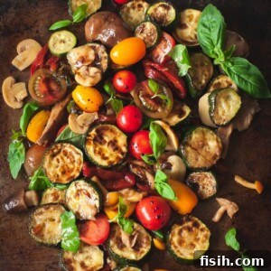warm zucchini salad with cherry tomatoes, peppers and mushrooms