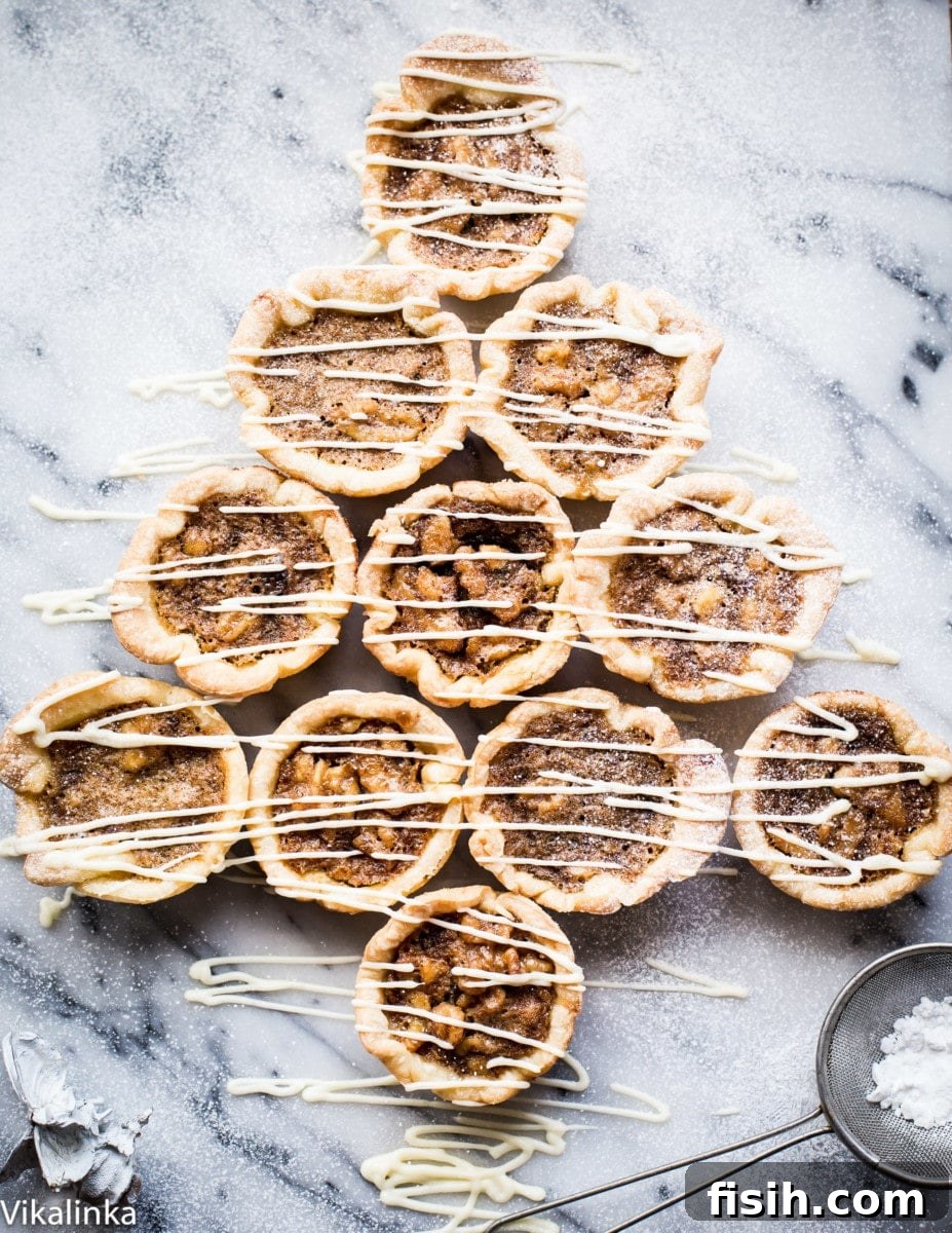 Golden Canadian Delights 2 Butter Tarts-flaky pastry tartlets filled with delicious golden custard, raisins and walnuts.