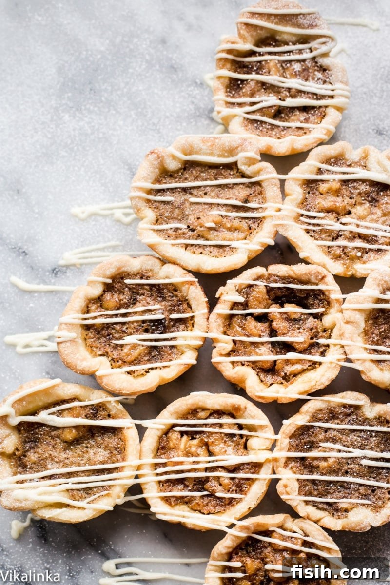 Golden Canadian Delights 4 Butter Tarts-flaky pastry tartlets filled with delicious golden custard, raisins and walnuts.
