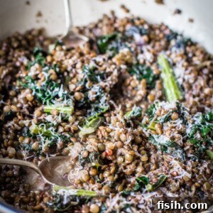 lentils and kale sprinkled with parmesan cheese, ready to be served.