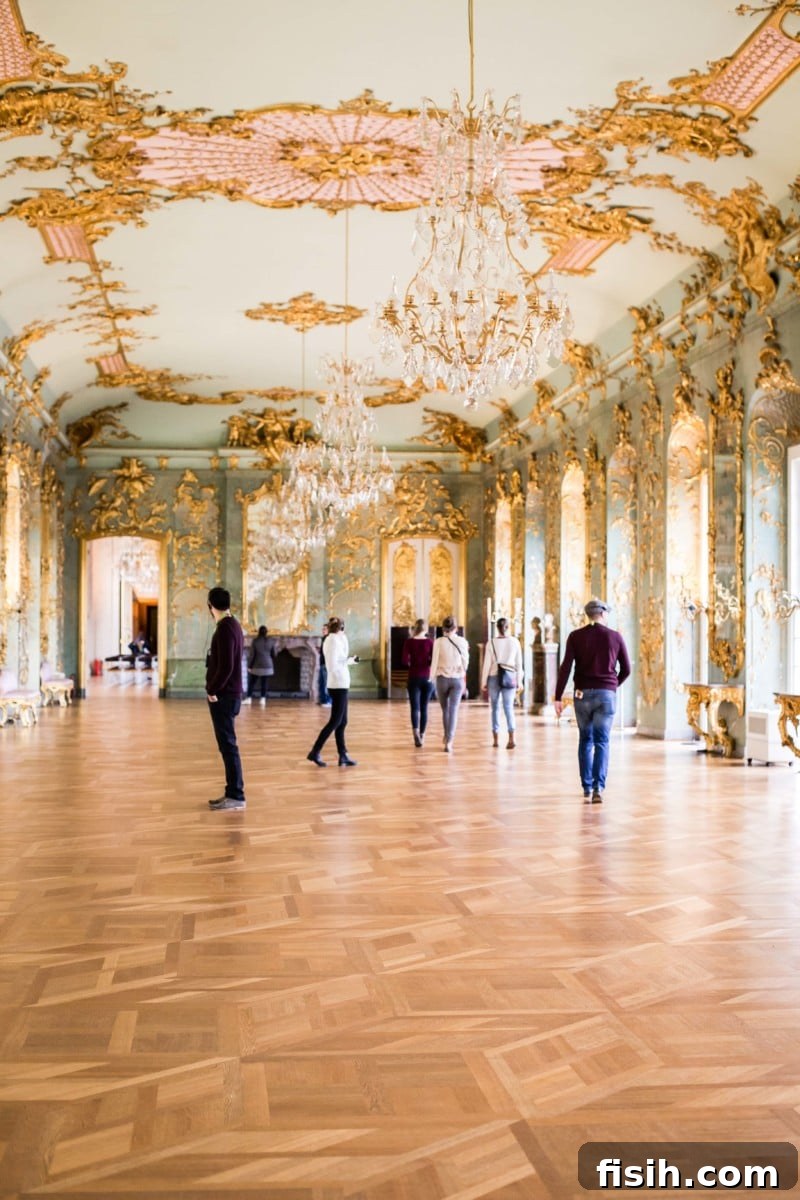 Old Berlin's Shimmering Splendor 9 Richly decorated walls and historical portrait in a Charlottenburg Palace chamber.