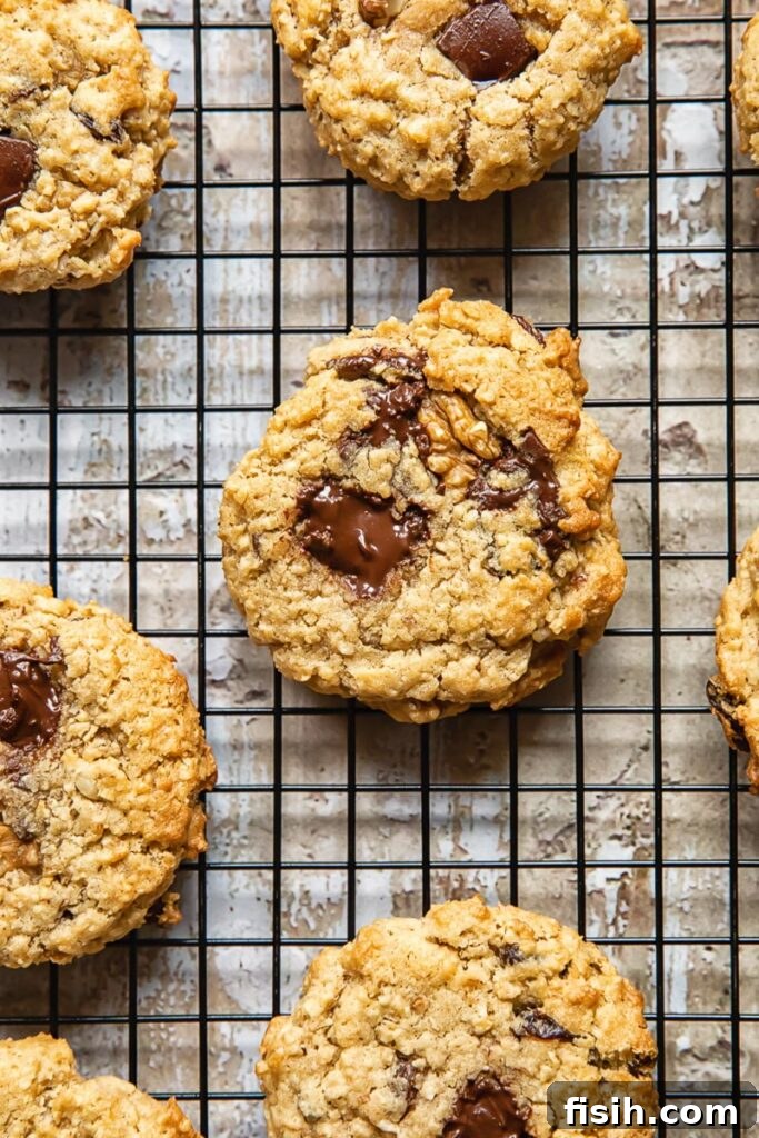 Top down shot of cowboy cookies with oats, chocolate and coconut on a wire rack