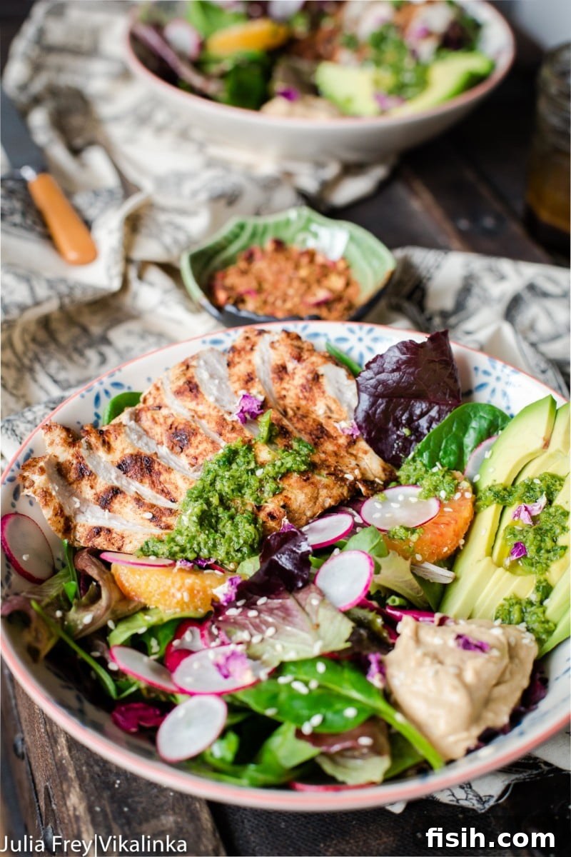 Eastern Mediterranean Mezze Bowl 6 Side shot showing the layered ingredients in a Middle Eastern Salad Bowl with a generous drizzle of zhoug on top