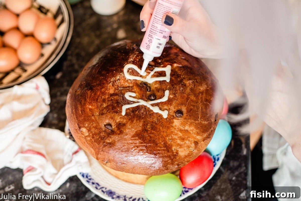 Decorating traditional Russian Easter Bread Kulich