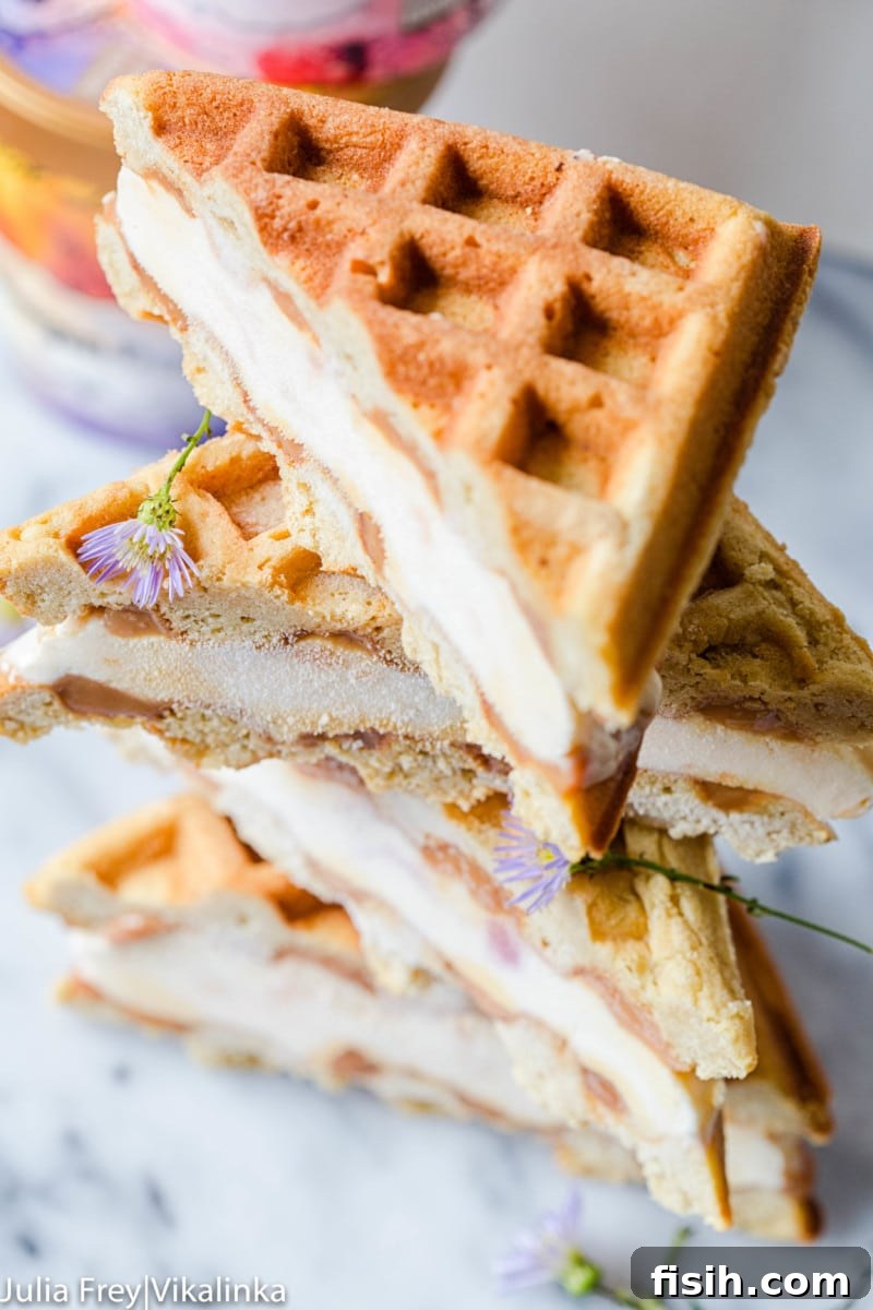 Ice Cream Wafflewiches 5 Top-angled view of several waffle ice cream sandwiches, artfully cut into triangles and ready for serving.