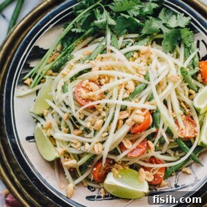 Top down of Thai green papaya salad in a bowl
