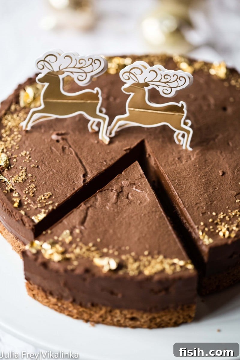 A whole Chocolate Truffle Cake on a white cake stand, showcasing its elegant simplicity.