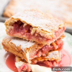 Generous Rhubarb Slab Pie 6 Close-up of Rhubarb slab pie pieces stacked on a plate