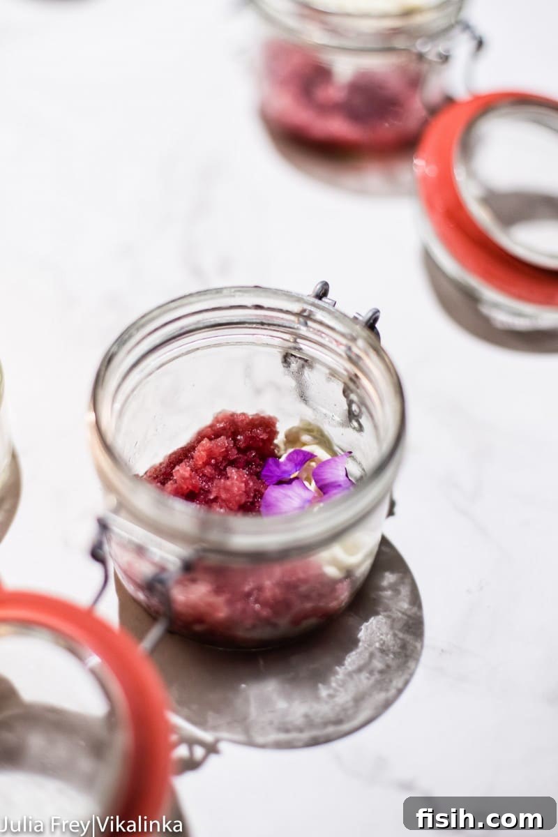 A stunning dessert, perhaps the 'Smoking Bishop Snow', with intricate presentation and rich colors