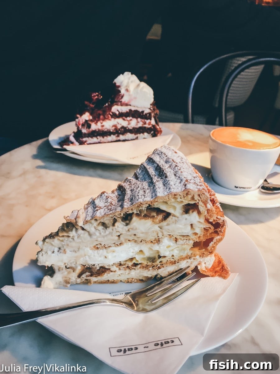 Assortment of decadent cakes and pastries in a cafe display